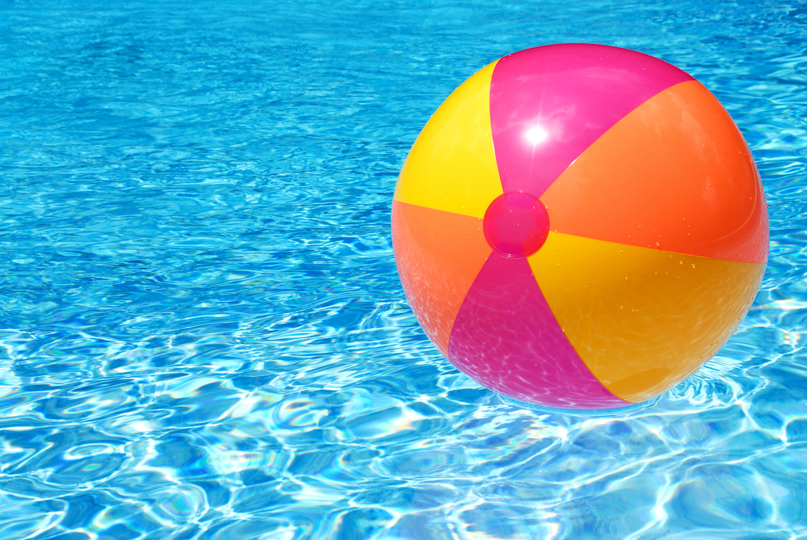 beach ball floating in pool water